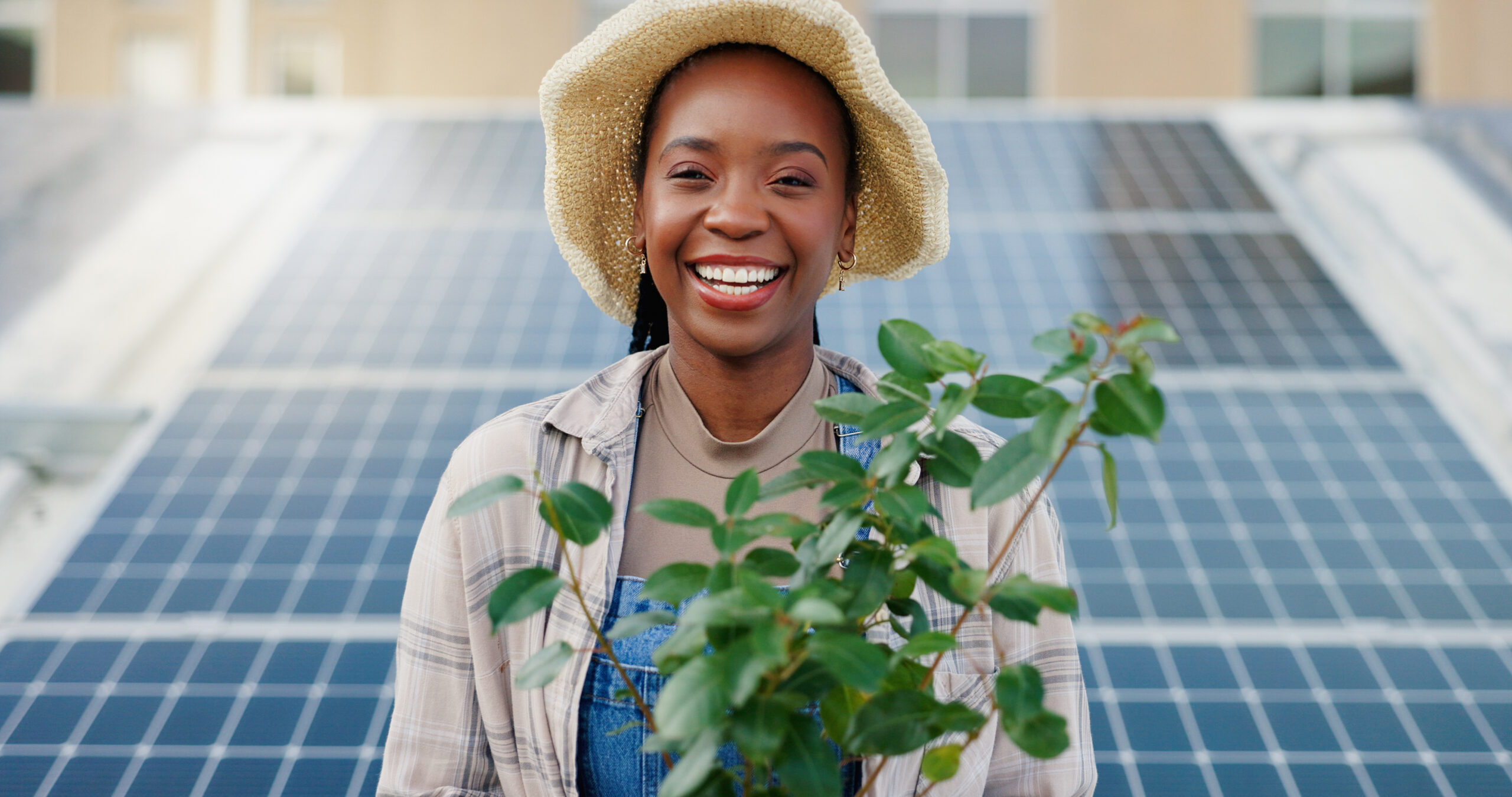 black woman portrait plant with solar panel eco friendly sustainable future infrastructure city farmer